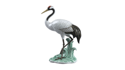 Elegant white and black crane figurine with red crown standing on stylized aqua waves, a beautiful porcelain sculpture. background removed
