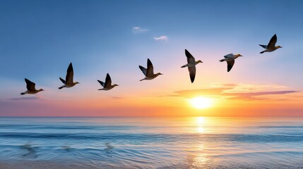 Fototapeta premium A serene sunset over the ocean, with birds soaring gracefully across the horizon, creating a tranquil and picturesque scene.