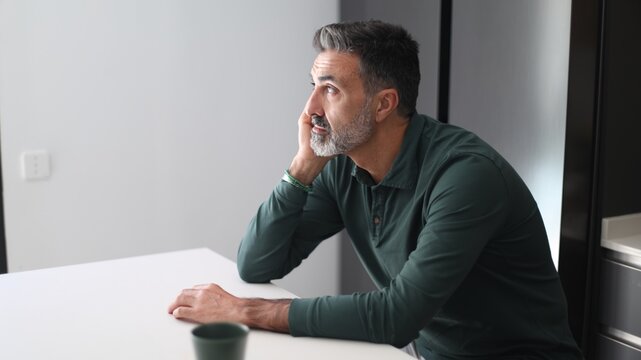 Pensive man thinking and contemplating future plans