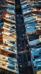 High Angle View of Narrow City Street and Roofs