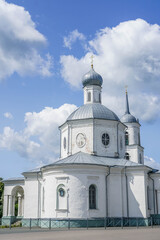 Fototapeta premium Historic Orthodox church and bell tower in Ostrov, Pskov oblast, Russia, an old Russian city. stock photo 