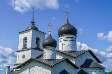St Nicholas the Wonderworker Church in Ostrov, Pskov oblast, Russia, historic white stone Orthodox temple in summer greenery. stock photo
