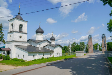 St Nicholas the Wonderworker Church in Ostrov, Pskov oblast, Russia, historic white stone Orthodox temple in summer greenery. stock photo
