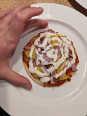A tiny pineapple pizza