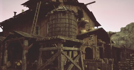 A rustic wooden barn stands prominently with an antique water tank on a sunny day. The surrounding area is filled with vintage farming tools and weathered structures, reflecting a bygone era. - Powered by Adobe