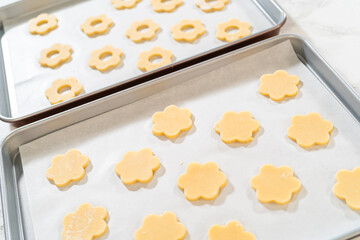 Two Trays of Flower Shaped Cookies Ready