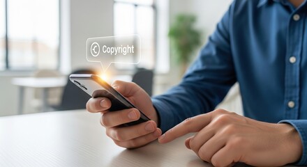 Digital copyright protection concept. Man holding smartphone with glowing Copyright symbol on screen.
