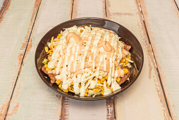 Colombian corn kernels with detached tender corn kernels, mixed with shredded pork, chorizo, Creole potato and hogao sauce