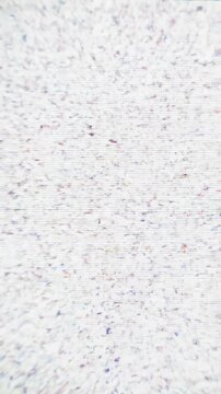 Rapid random digital pixelation and signal noise distorting across a screen creating chaotic technological interference and data decay information, programming, compression