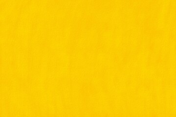 Fototapeta premium Colorful yellow background covers surface with smooth texture during bright daylight hours in a simple setting