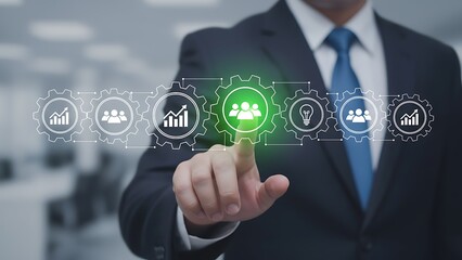 Businessman interacting with digital interface displaying business analytics and teamwork icons representing modern technology and strategic growth in corporate environment