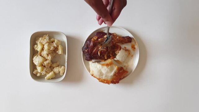 Eating Pap with Chicken and Potato Salad