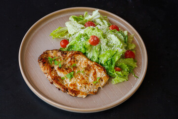 Grilled Chicken Breast With Fresh Green Salad On Plate Outdoors