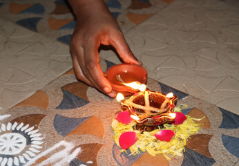 traditional lamp or agal vilakku with flower decoration
