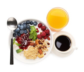 Healthy breakfast. Oatmeal with nuts, berries, jam, coffee and juice isolated on white, top view