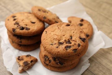 Delicious chocolate chip cookies on table, closeup