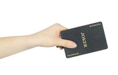 playing card joker in hand, outstretched hand with black playing card isolated from background