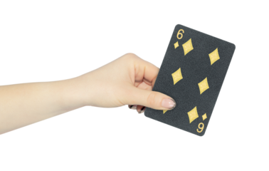 playing card diamonds 6 in hand, outstretched hand with black playing card isolated from background