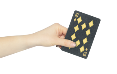 playing card diamonds 10 in hand, outstretched hand with black playing card isolated from background