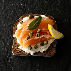 Smoked salmon on black bread with cream cheese and capers  