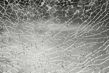 Shattered cracked glass background. Breaking the glass ceiling color of 2026 year cloud white