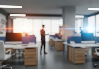 Blurred modern office interior with a person standing near a desk