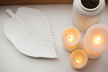 Led battery candles, tray and vase on white background