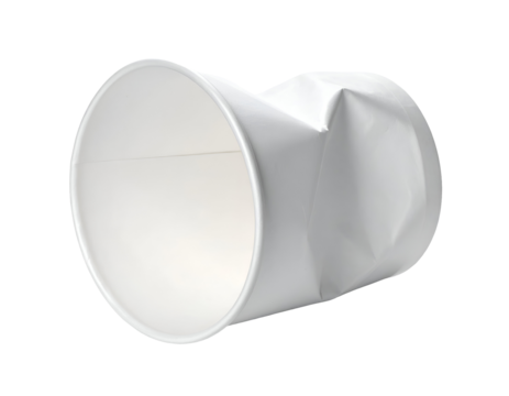 Crushed white disposable paper food cup lying on its side showing damaged packaging and recycling waste concept on isolated background