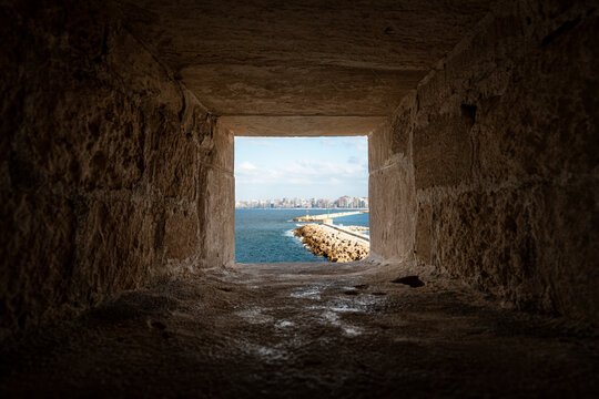 The Citadel of Qaitbay or the Fort of Qaitbay is a 15th-century defensive fortress located on the Mediterranean sea coast. Ordinary people walk nearby