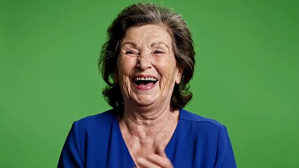 Genuine Laughter Elderly Woman Joyfully Laughing and Clapping on Green Screen Cheerful Senior Female Expressing Happiness and Amusement with a Wide Smile - Powered by Adobe
