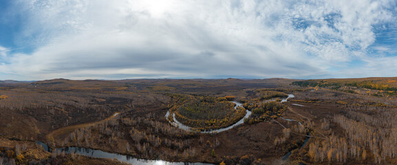 Aerial view of the autumn forests of the Mohe Eighteen Bends Scenic Area in the Greater Khingan Mountains