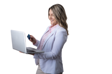 Smiling woman online shopping using laptop and credit card