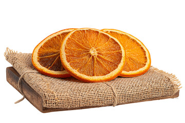 Three dried orange slices on a burlap cloth isolated on transparent background