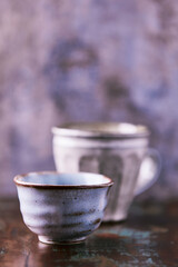Traditional japanese ceramic on rustic wooden background. Soft focus. Copy space.	