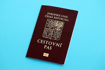 Czech biometrical passport on blue table background. Concept of citizenship of Czech Republic