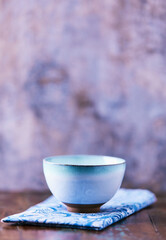 Traditional japanese ceramic on rustic wooden background. Soft focus. Copy space.	