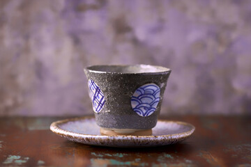Traditional japanese ceramic on rustic wooden background. Soft focus. Copy space.	