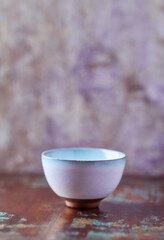 Traditional japanese ceramic on rustic wooden background. Soft focus. Copy space.	
