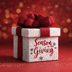 A festive gift box adorned with a shimmering red bow and the words Season of the Giving rests