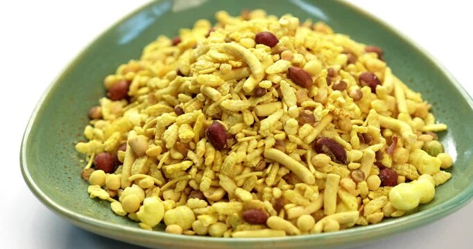 Bombay mix or Chanachur or Chiwda or farsan also known as khatta meetha chivda is an Indian snack mix, popular tea-time food from India
