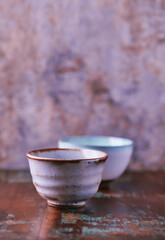 Traditional japanese ceramic on rustic wooden background. Soft focus. Copy space.	