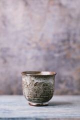 Traditional japanese ceramic on rustic wooden background. Soft focus. Copy space.	