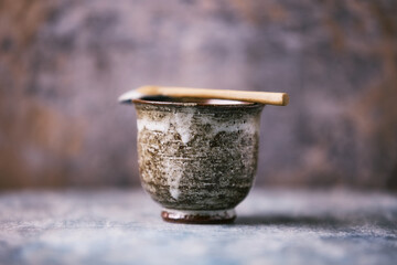 Traditional japanese ceramic on rustic wooden background. Soft focus. Copy space.	