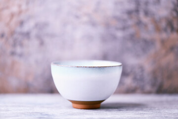 Traditional japanese ceramic on rustic wooden background. Soft focus. Copy space.	