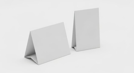 Two blank white table tent signs on a clean white background.
