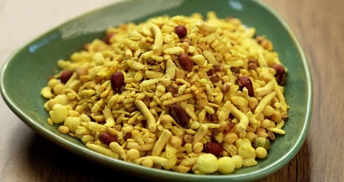 Bombay mix or Chanachur or Chiwda or farsan also known as khatta meetha chivda is an Indian snack mix, popular tea-time food from India