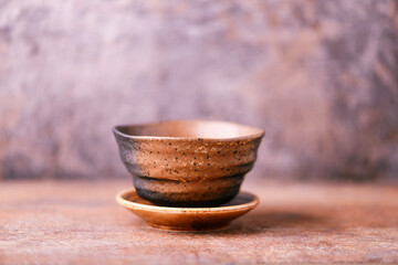 Traditional japanese ceramic on rustic wooden background. Soft focus. Copy space.	