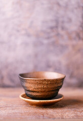Traditional japanese ceramic on rustic wooden background. Soft focus. Copy space.	