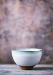 Traditional japanese ceramic on rustic wooden background. Soft focus. Copy space.	