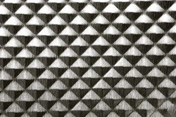 Tripartite brushed steel dark grey metal texture. pyramid geometric shape background color of 2026 year cloud white